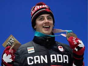 Canada's bronze medallist Mark McMorris poses on the podium during the medal ceremony for the snowboard Men's Slopestyle at the Pyeongchang Medals Plaza during the Pyeongchang 2018 Winter Olympic Games in Pyeongchang on February 11, 2018.