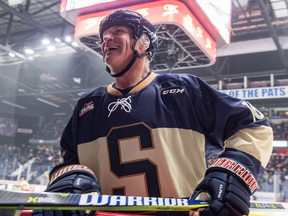 Mike Sillinger has a laugh with his teammates at the bench during the All-Star Celebrity Classic at the Brandt Centre on Saturday. The Classic was part of the Pats' Homecoming Weekend.