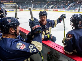 REGINA, SASK:  Feb. 17, 2018 -- Kelly Chase #39, left, chats with Brian Srudland #10, centre, and Mike Keane #12 on the bench during the All-Star Celebrity Classic game at the Brandt Centre. BRANDON HARDER/Regina Leader-Postp