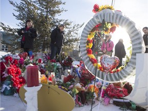 Mourners and supporters gathered at a memorial at the La Loche Community School on February 2, 2016.