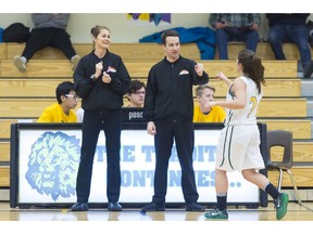 Campbell Tartans guard Miranda Johnston, right, fist-bumps the officials before Friday's senior girls game against the RIffel Royals at the Luther Invitational Tournament.