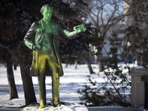 The statue of Canada's first prime minister John A. Macdonald appears vandalized in Victoria Park in Regina.