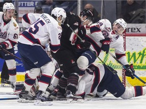 Regina Pats centre Jake Leschyshyn is knocked down during a pileup in the crease during WHL action against the Moose Jaw Warriors on Wednesday night at the Brandt Centre.