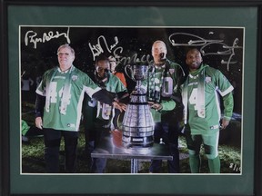 This signed, framed photo of Saskatchewan Roughriders legends Roger Aldag, George Reed, Gene Makowsky and Darian Durant will be available at the Regina Leader-Post's annual charity sports memorabilia sale, to be held April 29.