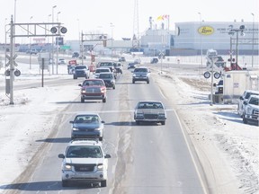 Westbound traffic flows over two sets of rail tracks on the Ring Road near Winnipeg Street.