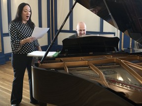 Gordon Gerrard, RSO Music Director, and Marion Newman, a mezzo-soprano guest performer, rehearse for an upcoming Forward Currents festival to be held at the MacKenzie Art Gallery in Regina.