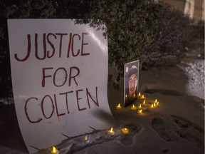 A sign and photo of Colten Boushie sits in front of the Court of Queen's Bench on the day of closing arguments and first day of jury deliberation in the trial of Gerald Stanley, the farmer accused of killing the 22-year-old Indigenous man, in Battleford, Sask., Thursday, February 8, 2018.