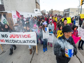 Protestors march down Victoria Avenue to show their frustration following the acquittal of Raymond Cormier who was charged with second-degree murder in the death of 15-year-old Tina Fontaine.