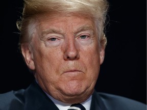 President Donald Trump listens during the National Prayer Breakfast, Thursday, Feb. 8, 2018, in Washington.