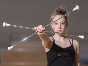 REGINA, SASK : January 24, 2018 - Alyssa Hendry holds up twirling batons at the Martin School of Dance & Baton Twirling. MICHAEL BELL / Regina Leader-Post.