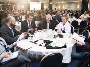 Regina Mayor Michael Fougere, from second left, councillors Bob Hawkins and Barbara Young attend the SUMA convention at the Queensbury Convention Centre Tuesday.
