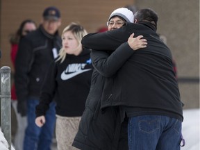 La Loche Mayor Robert St. Pierre hugs MP Georgina Jolibois outside La Loche provincial court on the day a judge issued her sentencing decision for the teen who pled guilty in the 2016 school shooting in La Loche, Sask. on Friday, February 23, 2018.