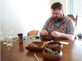 Chris Pratt, a Medicinal Marijuana smoker, rolls a joint at his home in Saskatoon, SK on March 14, 2018.