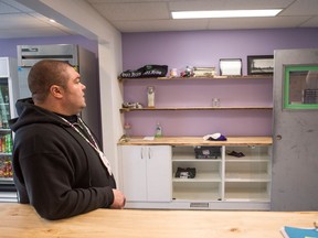 Pat Warnecke, the owner of Best Buds Society in the Warehouse District in Regina, looks at the empty shelves in his shop after it was raided by police.