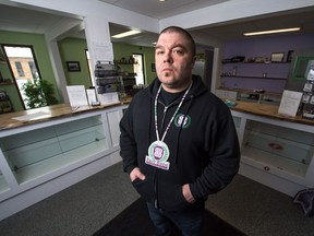Pat Warnecke, the owner of Best Buds Society in the Warehouse District in Regina, poses for a portrait in his shop after it was raided by police.