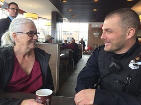 Lynne Lynch (left) and Const. Tyler Lerat chat over coffee. Officers from the Regina Police Service chat with local residents at the McDonald's on Dewdney Avenue as part of the Coffee with a Cop program, which brings officers and the communities they serve together.