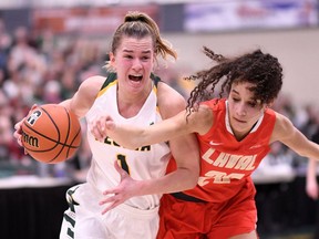 Charlotte Kot of the University of Regina Cougars drives to the basket against the Laval Route et Or during the U Sports national women's basketball championship in Regina on Thursday.