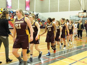 The LeBoldus Golden Suns shake hands with the Saskatoon Aden Bowman Bears after winning the 5A SHSAA Hoopla gold-medal game in Prince Albert on Saturday.