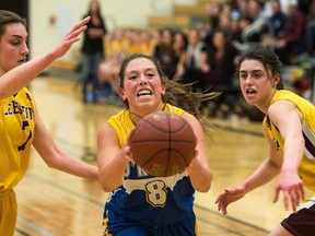 Mackenna Klotz (centre) of the O'Neill Titans pushes through the defence of LeBoldus Golden Suns during the RIBL senior girls Tier 1 city final. The Titans and Golden Suns both open play on Thursday at Hoopla in Prince Albert.