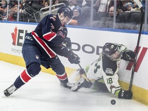 Kobe Mohr of the Edmonton Oil Kings slides into the boards in front of Regina Pats defenceman Libor Hajek at Rogers Place on Sunday.