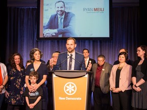 Ryan Meili addresses the Saskatchewan NDP convention after beating Trent Wotherspoon in the party leadership race on March 3, 2018. NDP MP Erin Weir joined Meili on stage, along with NDP MLAs.