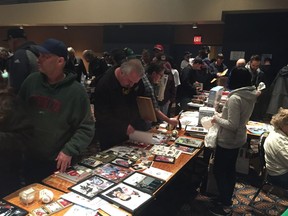 Sports fans flock to the Regina Leader-Post's tables during the 2017 charity memorabilia show at the Conexus Arts Centre. This year's sale is scheduled for April 29 in the Jacqui Shumiatcher Room. Proceeds will go to the Christmas Cheer Fund.