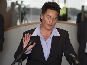 FILE - In this Sept. 28, 2015, file photo, former University of Minnesota Duluth women's hockey coach Shannon Miller speaks about the discrimination lawsuit she and two other female coaches have filed against the school