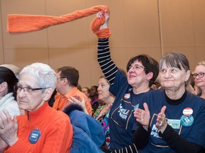 A Ryan Meili supporter waves her orange scarf in support moments before it was announced that Meili was the winner of the NDP leadership race on March 3, 2018, in Regina.