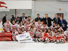 The Notre Dame Hounds celebrate the Saskatchewan Midget AAA Hockey League championship on Wednesday in Prince Albert.