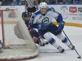 Swift Current Broncos defenceman Colby Sissons tries to escape the pursuit of Regina Pats captain Sam Steel during Game 1 of a first-round playoff series on Friday in Swift Current.