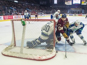 Regina Pats forward Matt Bradley tries to bang in a loose puck during WHL action against the Swift Current Broncos on Friday at the Brandt Centre.