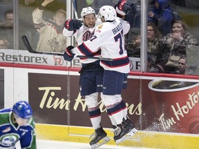 Jared Legien, left, and Matt Bradley of the Regina Pats celebrate a second-period goal against the Swift Current Broncos in Game 4 of their WHL playoff series on Wednesday.