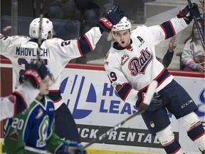 Regina Pats forwards Jake Leschyshyn, right, and Scott Mahovlich celebrate a goal Wednesday against the  Swift Current Broncos.