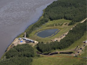 Crews work to clean up an oil spill on the North Saskatchewan river near Maidstone, Sask on Friday July 22, 2016.