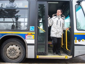 Dylan Morin, pictured here riding a Regina Transit bus. Morin is one of the transit trainers with intellectual disabilities who will soon be helping their peers learn to ride the bus.