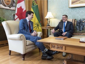Prime Minister Justin Trudeau and Saskatchewan Premier Scott Moe meet at the Legislative Building in Regina on Friday, March 9, 2018. They spoke again over telephone on Tuesday.