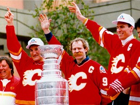 Current Moose Jaw Warriors head coach Tim Hunter, left, was part of the Calgary Flames' Stanley Cup celebration in 1989 with Lanny McDonald, centre, and Jim Peplinski.