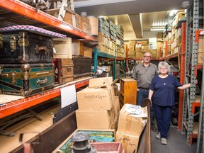 Rob Deglau, left, and Jan Morier stand in the Civic Museum of Regina's storage space on Broad Street.
