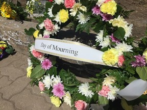 Flowers and wreathes were laid at City Hall in Regina, in recognition of the National Day of Mourning, which honours people who have been killed on the job.