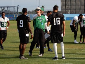 Saskatchewan Roughriders quarterbacks coach Steve Walsh (centre) was pleased with the performances of pivots David Watford (9) and Brandon Bridge during the team's mini-camp.