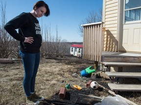 SOUTH OF LUMSDEN, SASK : April 27, 2018  -- Tiffany Schaefer looks over her property south of Lumsden, Saskatchewan following a grass fire in the area. She was amazed that the flames had come right to the edge of her home, but it never caught fire. BRANDON HARDER/ Regina Leader-Post