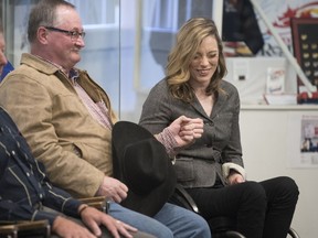 Lisa Franks, right, shares a bump with Rick Nash during Thursday's media conference to announce the Saskatchewan Sports Hall of Fame's 2018 inductees. Franks is being inducted as a wheelchair athlete. Nash's father, Dick, is to be inducted as a rodeo athlete.