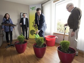 Minister of Social Services Paul Merriman takes part in a indoor sod-turing ceremony during H.E.L.P. Homes of Regina (Hope, Education, Love, Protection) announcement to start the building of a home for the agency's BRIDGE (Building Residential Independence through Diversity, Guidance & Education) Program in Regina.