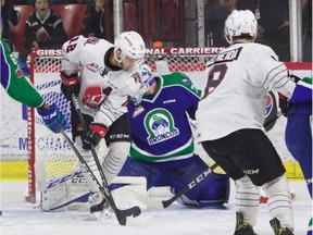 Jayden Halbgewachs of the Moose Jaw Warriors tries to get a shot on Swift Current Broncos goalie Stuart Skinner during Game 5 of their WHL playoff series on Friday.