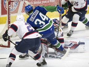 Swift Current Broncos centre Matteo Gennaro fights for the puck during a first-round WHL playoff series against the Regina Pats.