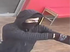 Regina police are searching for a male suspect who is alleged to have committed an armed robbery at a business in the city's northwest.