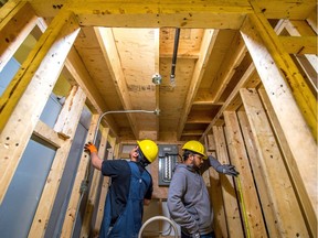 REGINA, SASK : March 21, 2018  -- Leo Gamoso, left, and Ajay Kumar work together to wire a small room during an exercise being held by the electrical class at the Regina Trades and Skills Centre in Regina. BRANDON HARDER/ Regina Leader-Post