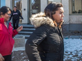 Tia Pinacie-Littlechief, right, leaves Court of Queen's Bench in Regina after being found not guilty in Justin Crowe's 2015 stabbing death.