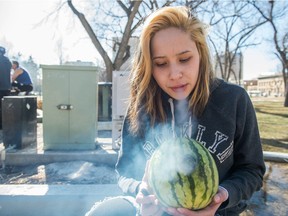 Serenity Anderson smokes her melon bong in Victoria Park in Regina where marijuana enthusiasts had gathered to smoke.