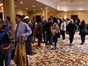 A large crowd gathered on the second floor of the Radisson Hotel in Saskatoon on May 10, 2018, waiting to enter the hearing regarding the federal government's Sixties Scoop settlement offer of $800 million.